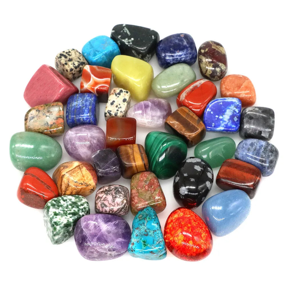 Assorted colorful gemstones on a white background