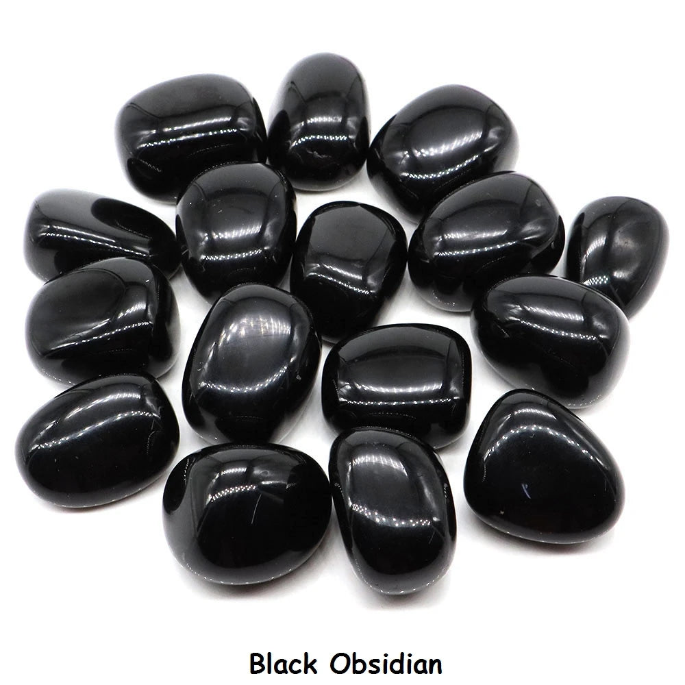 Collection of black obsidian stones on a white background