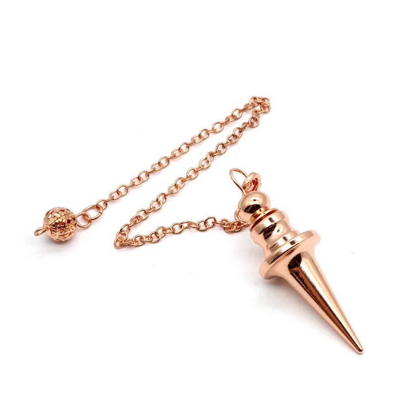 Rose gold spike pendant on a chain against a white background