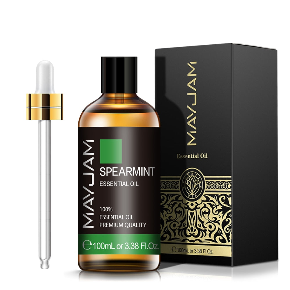 Spearmint essential oil bottle with dropper and packaging on a white background