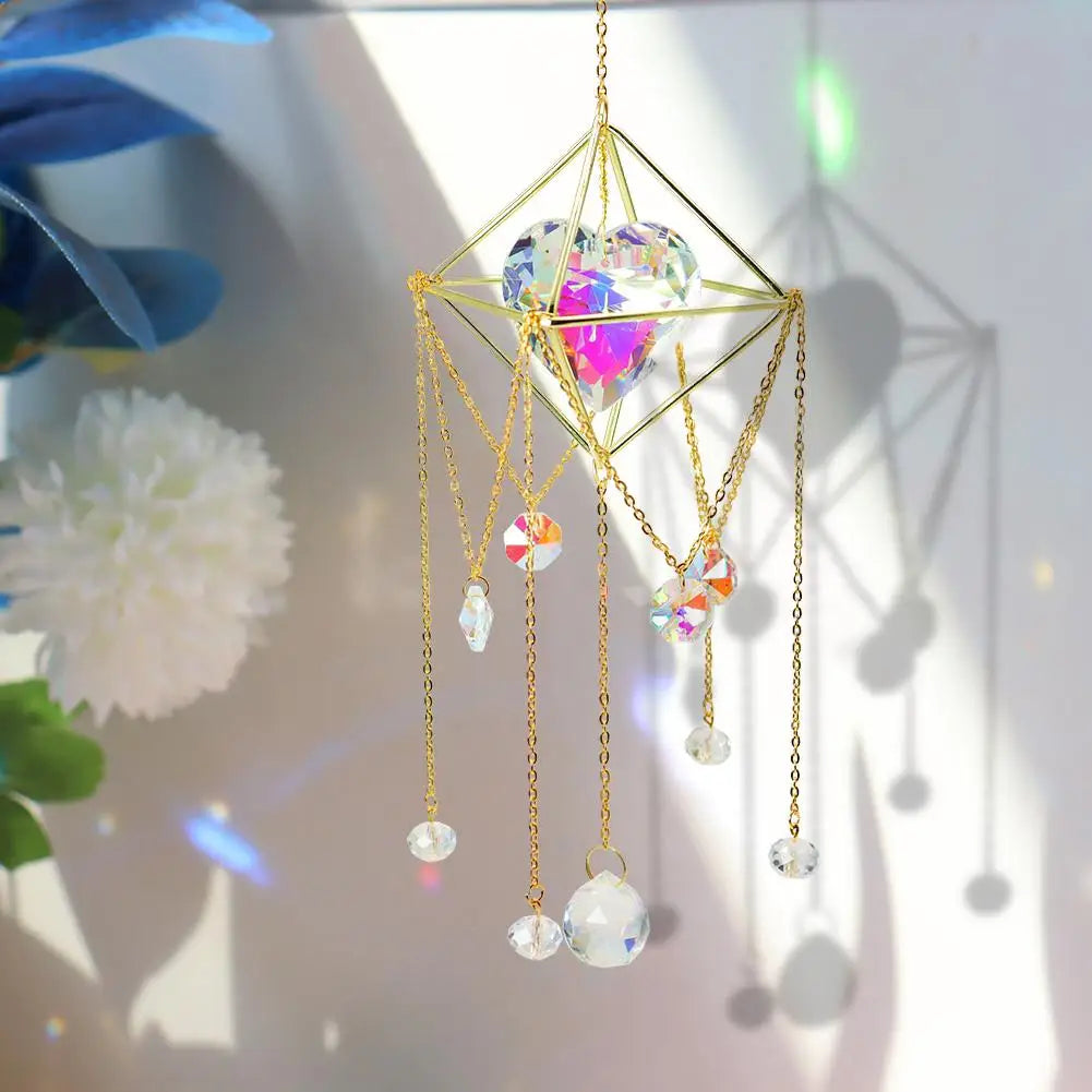 Decorative hanging crystal with gold chains and colorful beads on a blurred background