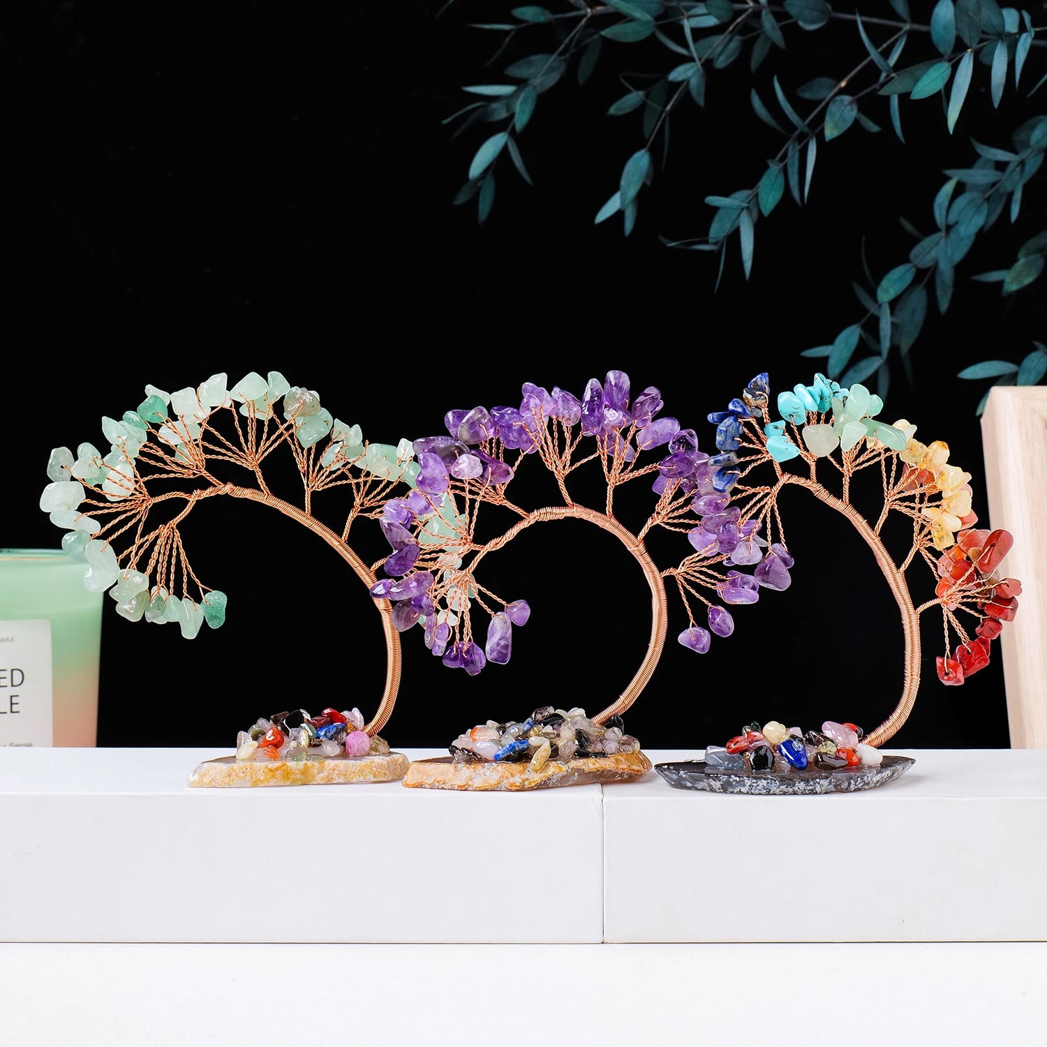 Decorative headbands with colorful stones on a white surface with a black background