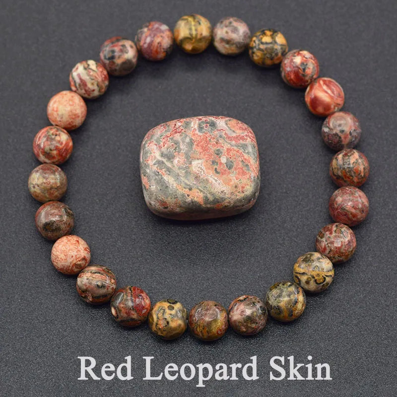 Bracelet made of red leopard skin Jasper beads on a dark background