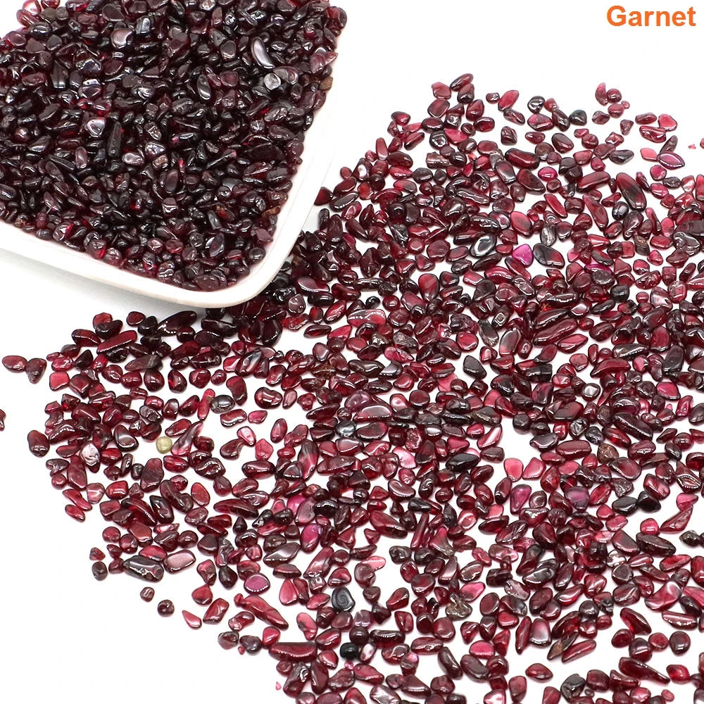 Garnet stones with a bowl on a white background
