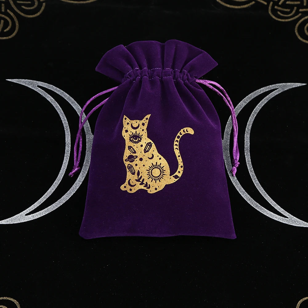 Purple drawstring bag with a gold cat design on a black background with moon symbols.