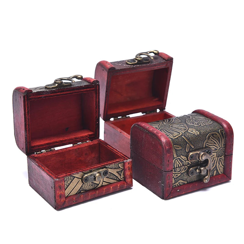 Two red jewelry boxes with intricate designs on a white background