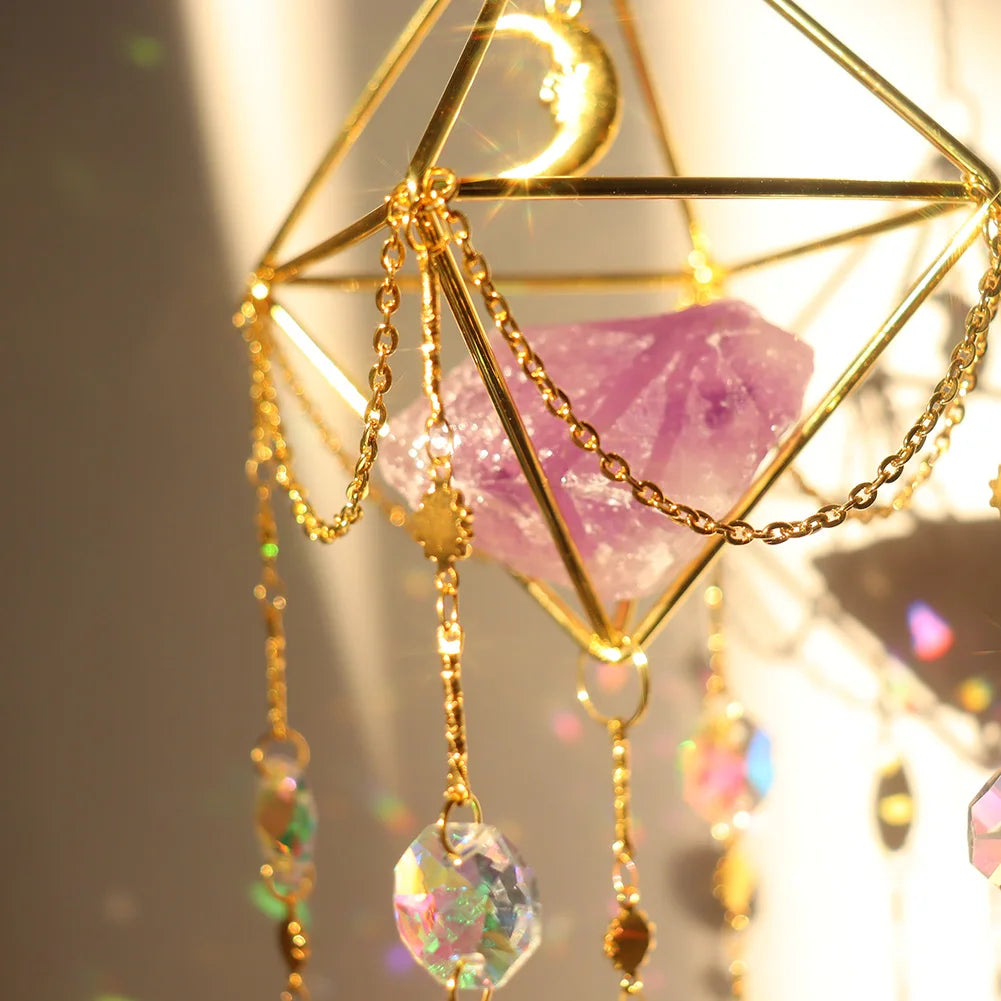 Decorative hanging crystal with gold chains and geometric design