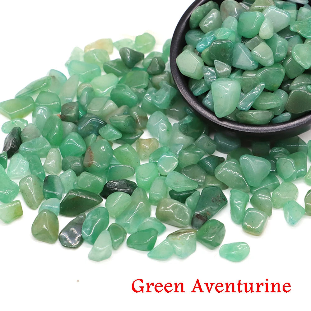 Green aventurine stones with a bowl on a white background
