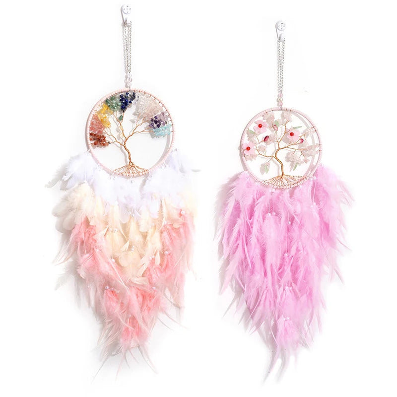 Pair of feather earrings with colorful tree design on a white background