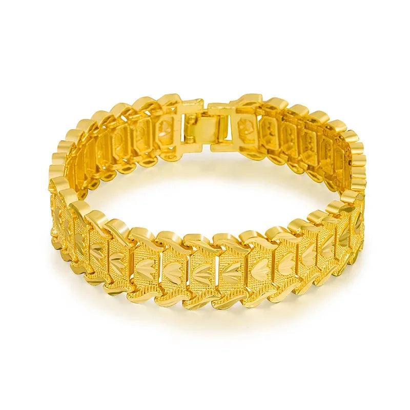 Gold bracelet with a textured design on a white background