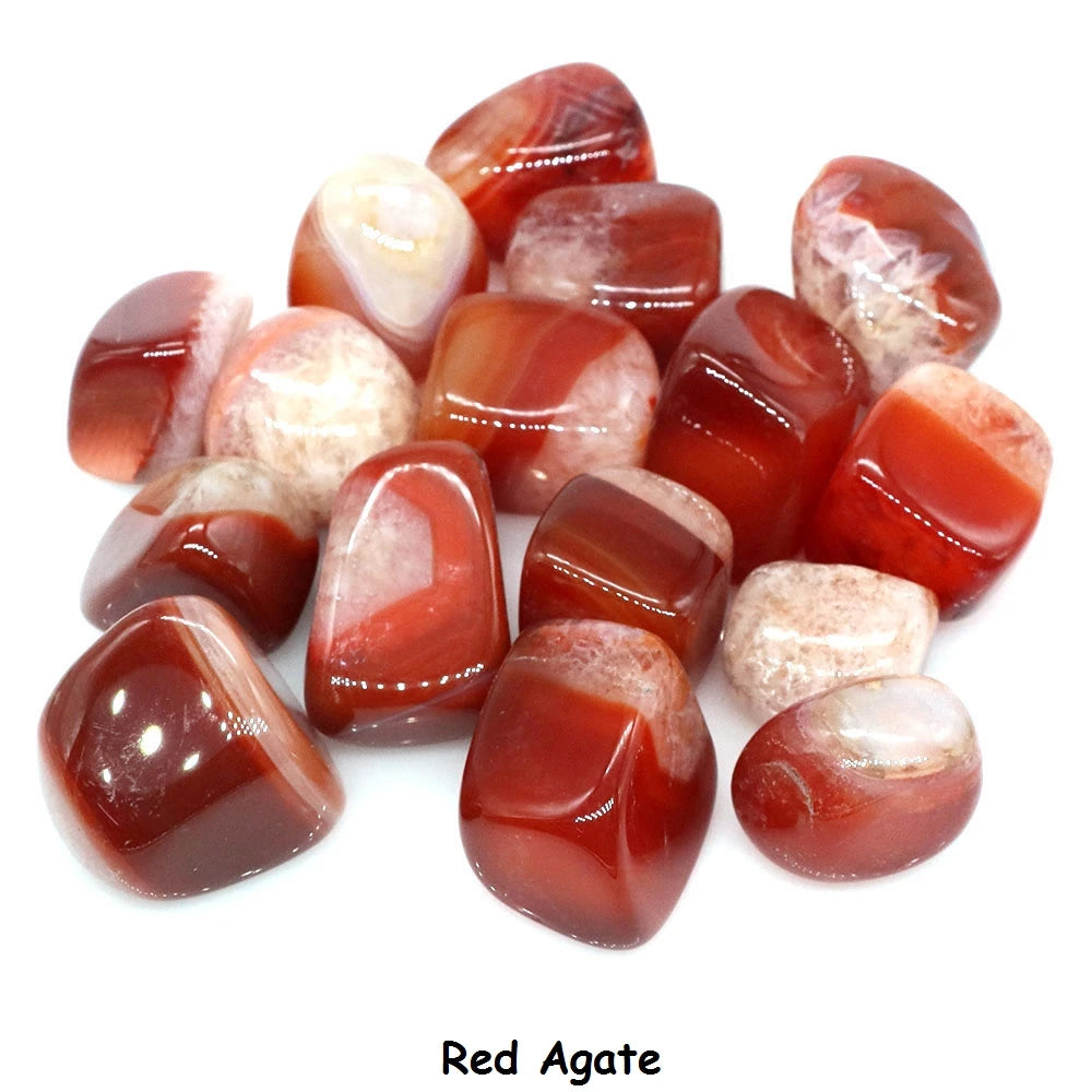 Collection of red agate stones on a white background