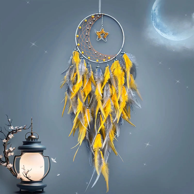 Dreamcatcher with yellow feathers against a starry night sky with a lantern.