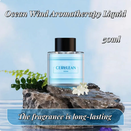 Cerulean Ocean Wind Aromatherapy Liquid bottle on a rock with ocean-themed text and imagery.