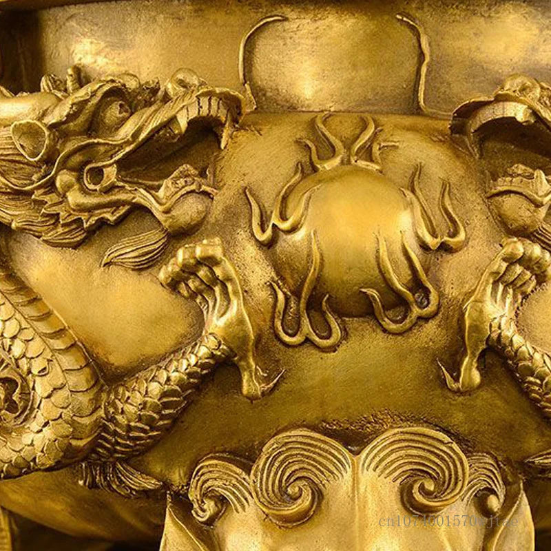 Close-up of a gold dragon and ball emblem, likely from Chinese culture.