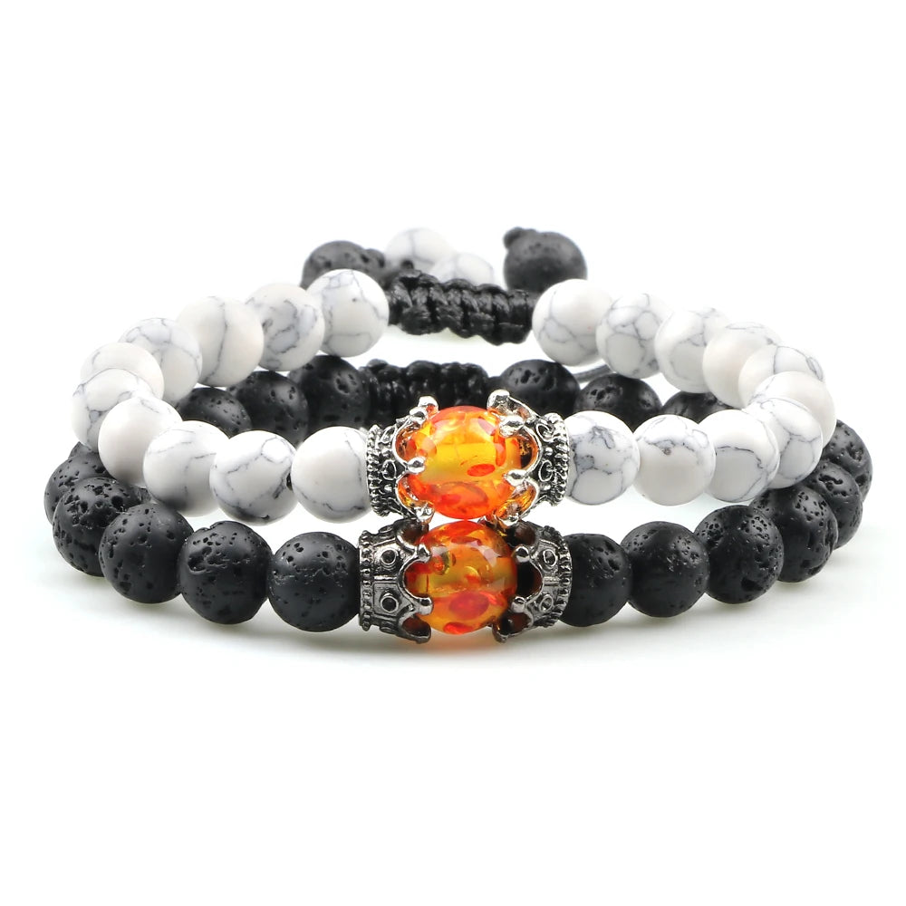 Three beaded bracelets with lava rock and white stones on a white background