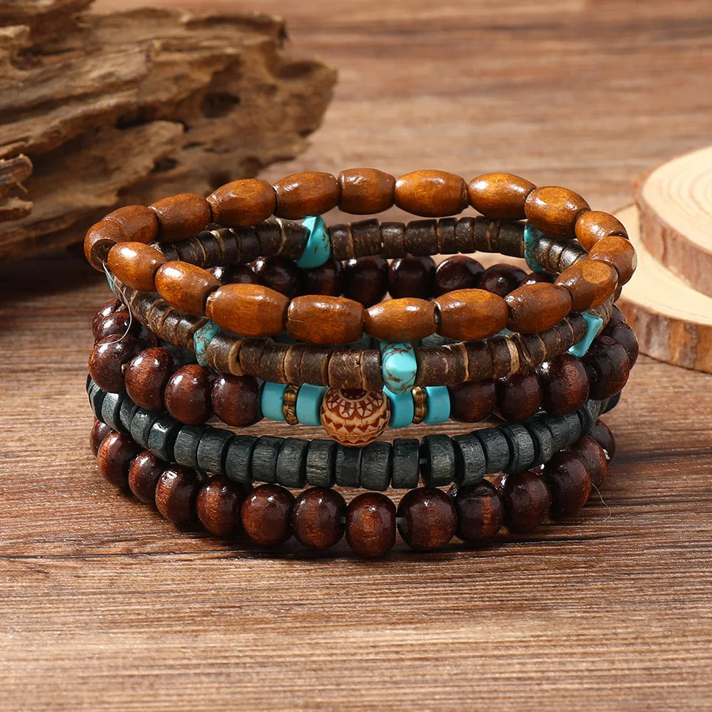 Stack of wooden beaded bracelets with turquoise accents on a wooden surface