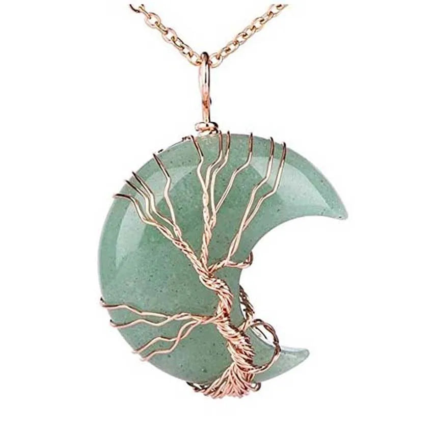 Necklace with a green stone pendant and rose gold tree design on a white background