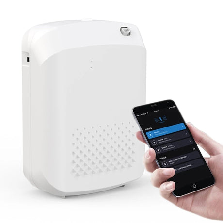 White electronic device next to a smartphone with app interface on a white background
