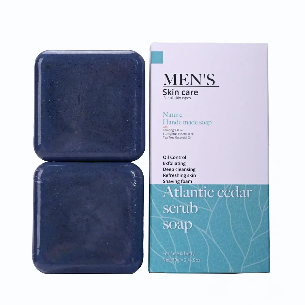 Two bars of Atlantic Cedar scrub soap next to its packaging on a white background