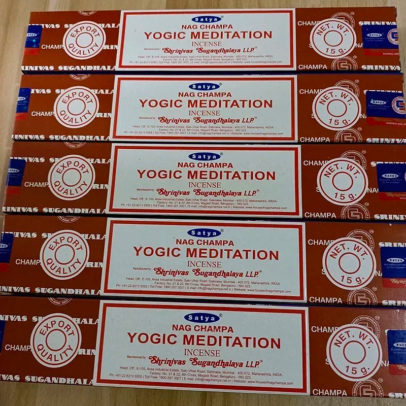 Multiple boxes of Satya Nag Champa Yogic Meditation Incense on a wooden surface