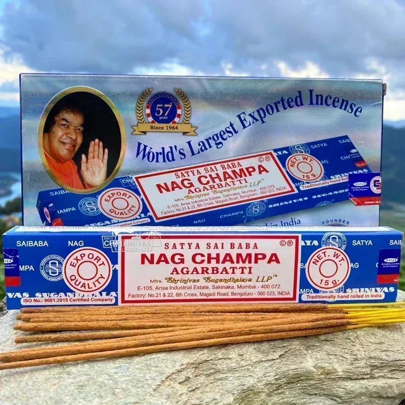 Satya Nag Champa incense sticks with packaging against a natural background