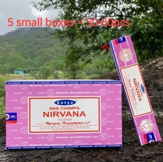Satya Nirvana Nag Champa incense packaging with a scenic background