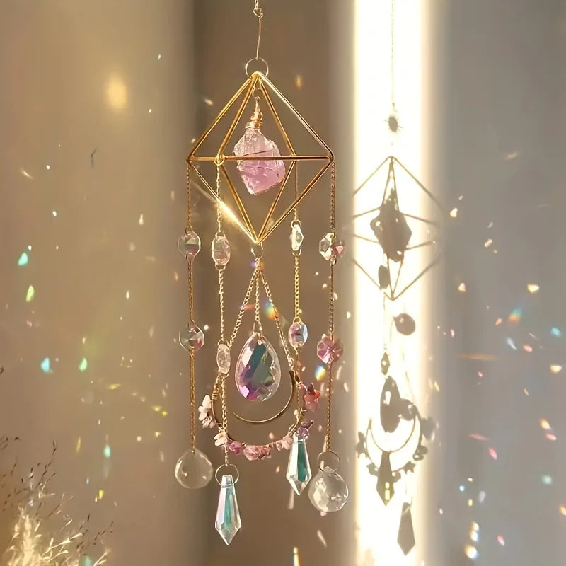 Decorative hanging crystal mobile with colorful stones against a soft background