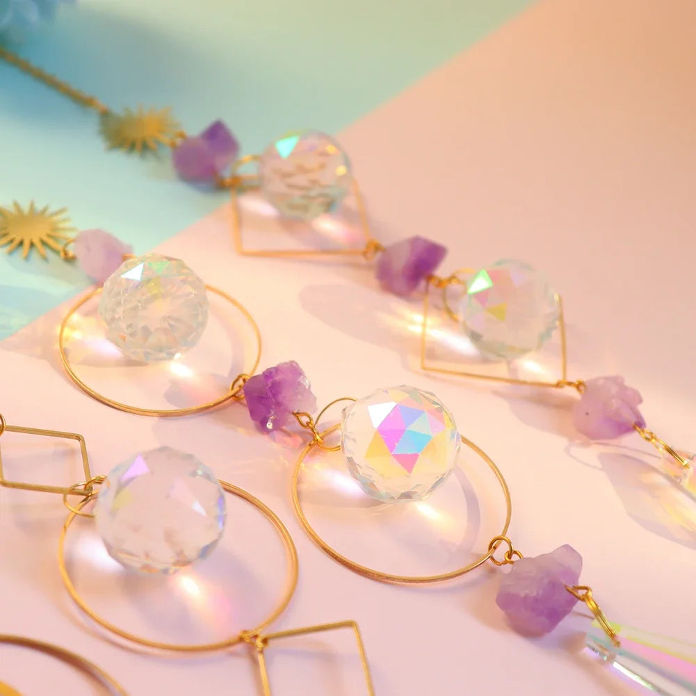 Decorative string lights with crystal-like beads on a soft pink background