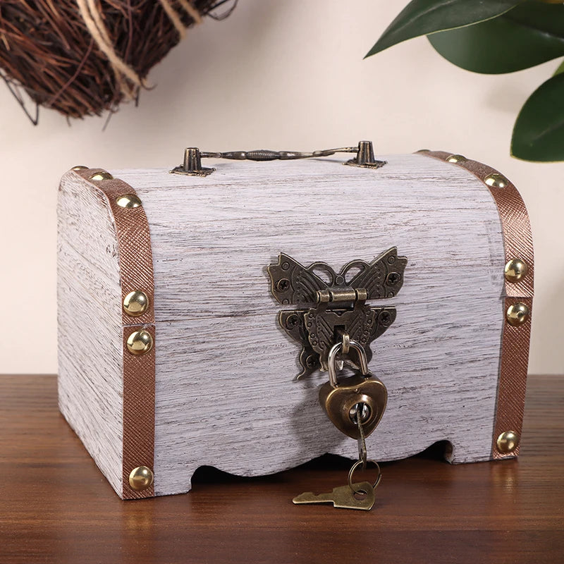 Wooden treasure chest with decorative lock and key on a wooden surface