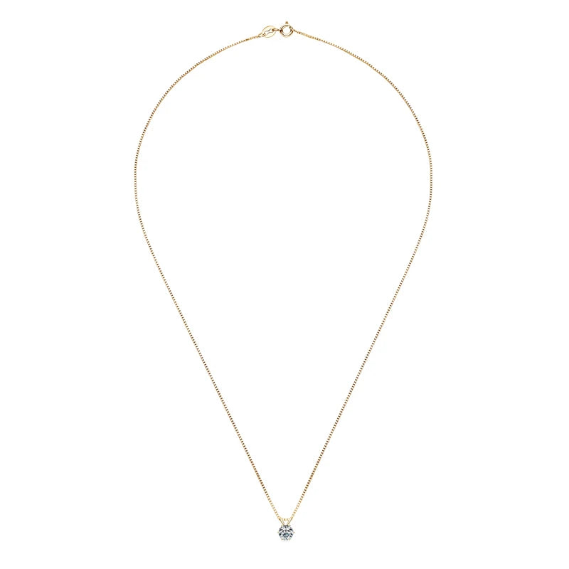 Gold necklace with a small pendant on a white background