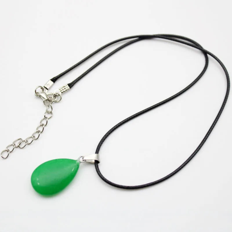 Necklace with a green teardrop pendant on a white background