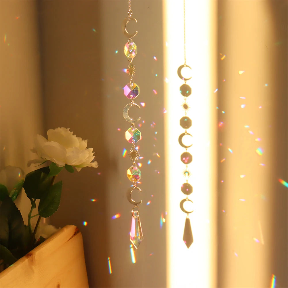 Decorative hanging crystal with rainbow, placed against a neutral background.