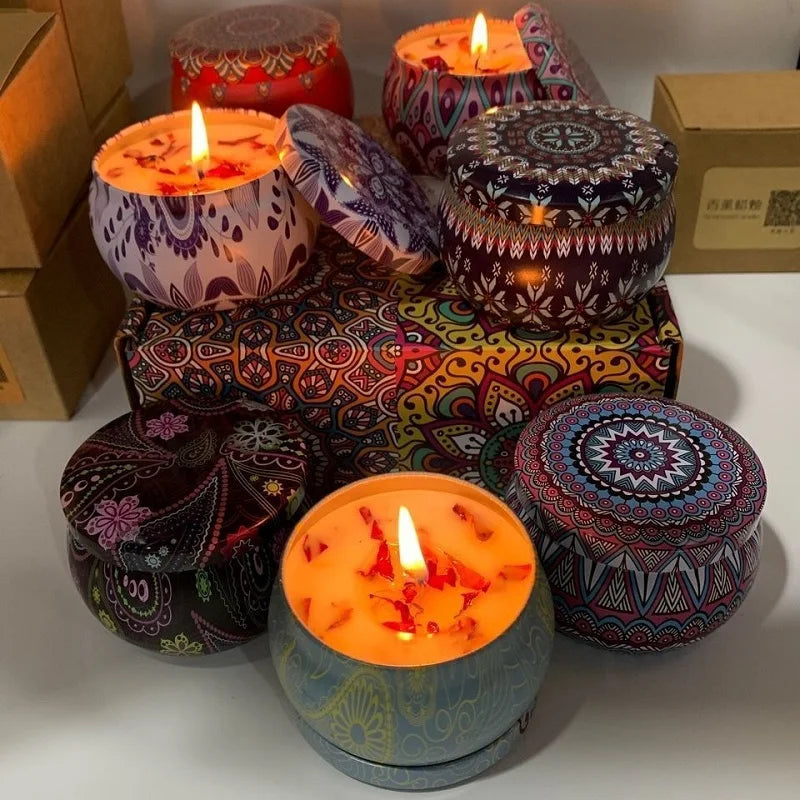 Decorative candles with colorful patterns on a white surface