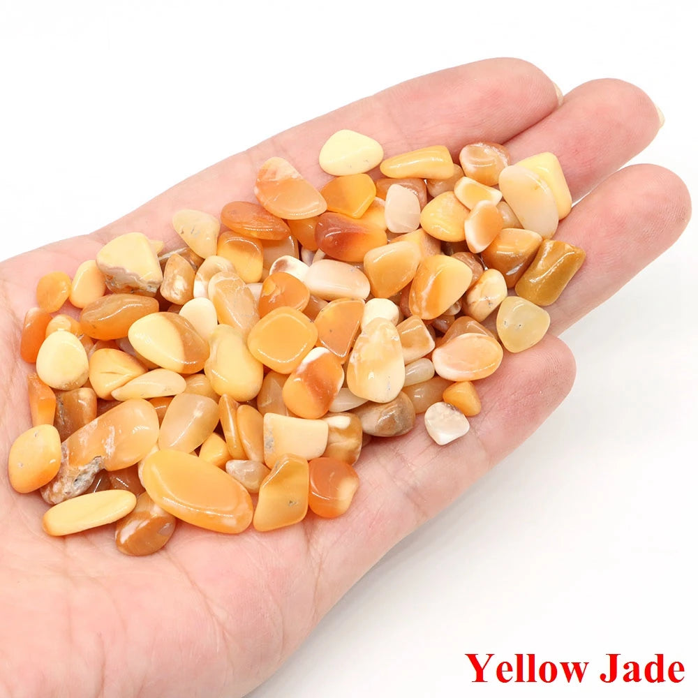 Hand holding yellow jade stones with 'Yellow Jade' text on a white background