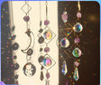 Decorative hanging crystal sun catchers with rainbow折射效果, promotional text overlay.