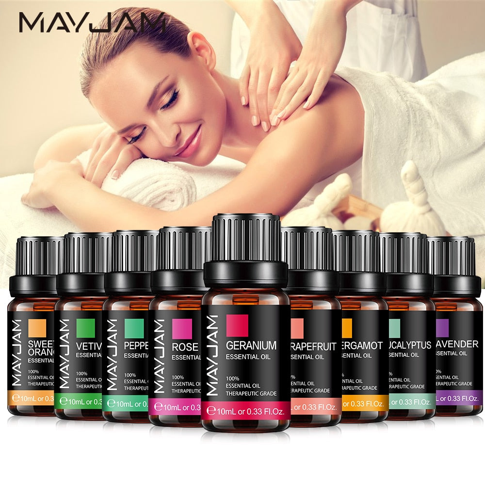 Woman receiving a massage with MayJam essential oils displayed in the foreground.