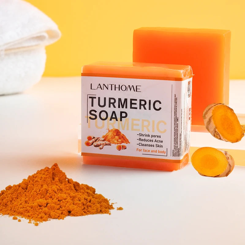 Lanthome Turmeric Soap with turmeric powder and pieces on a white background