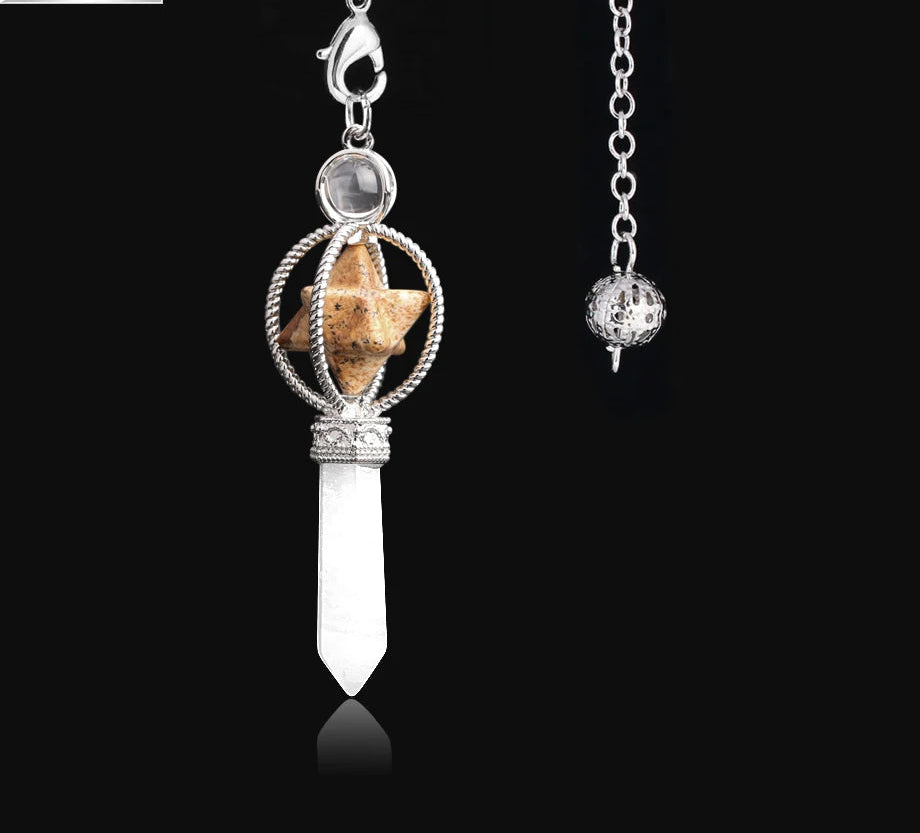 Silver pendant with crystal and stone on a black background