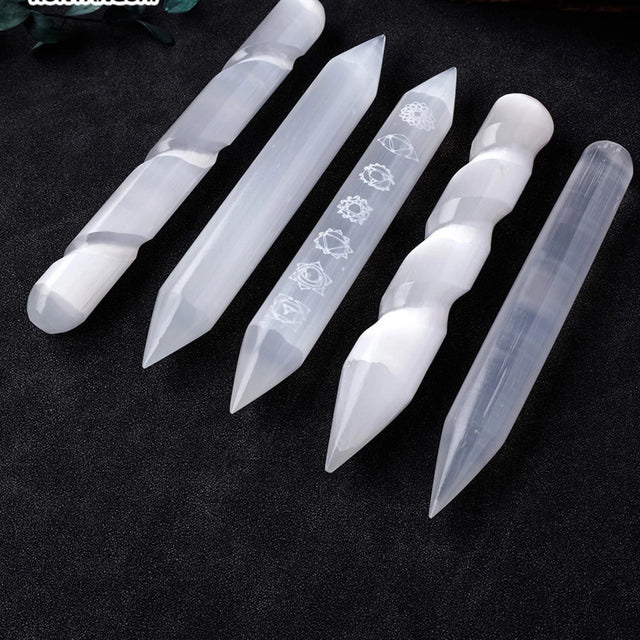 Set of five clear crystal tools with engraved designs on a dark background, branded 'Chakra Stone Runyangshi'.