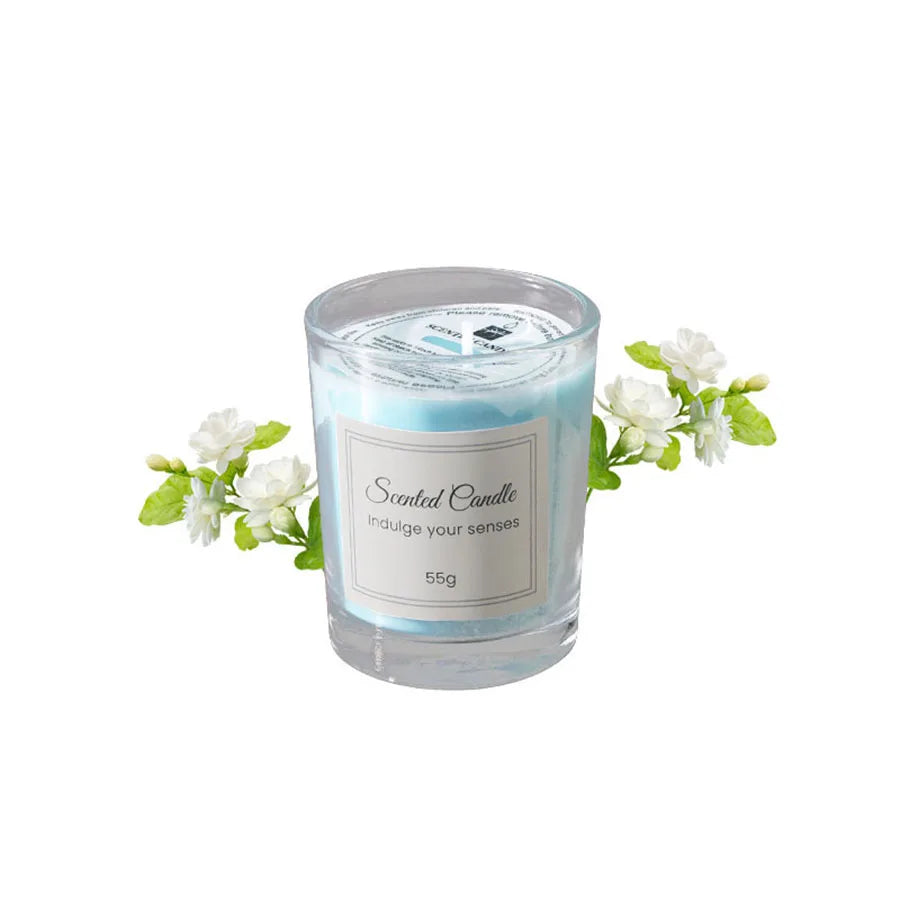 Scented candle with a label and floral decorations on a white background