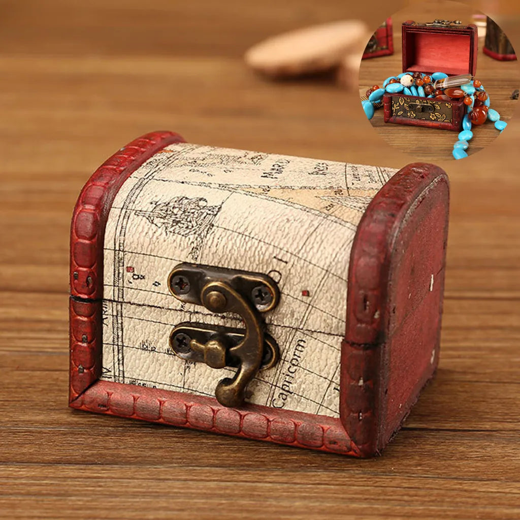 Vintage-style jewelry box with world map design on a wooden surface