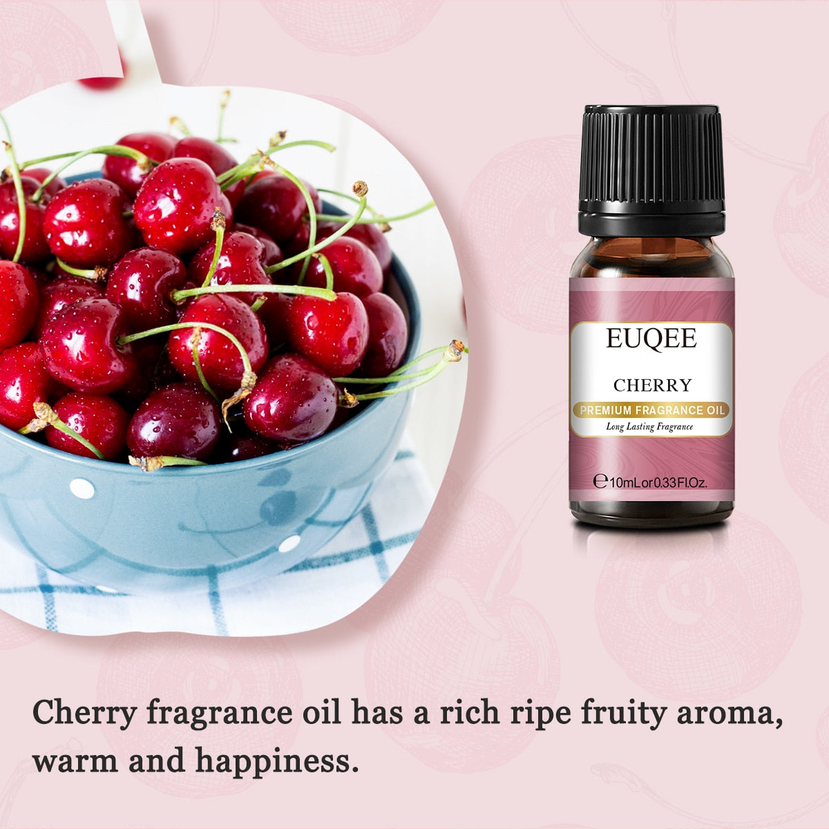 Bowl of cherries next to a bottle of EUQEE Cherry fragrance oil on a pink background
