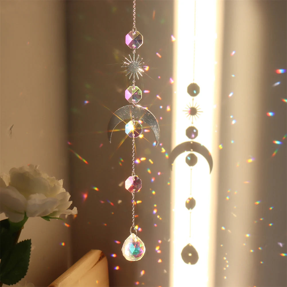 Decorative hanging crystal with rainbow折射效果, placed against a neutral background.
