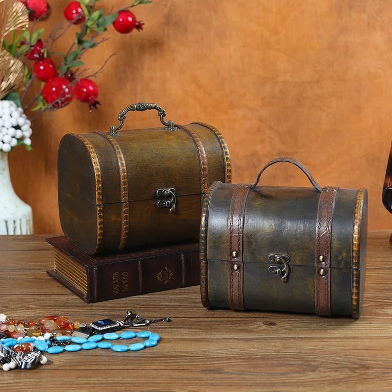 Two vintage-style leather boxes on a wooden surface with decorative items around.