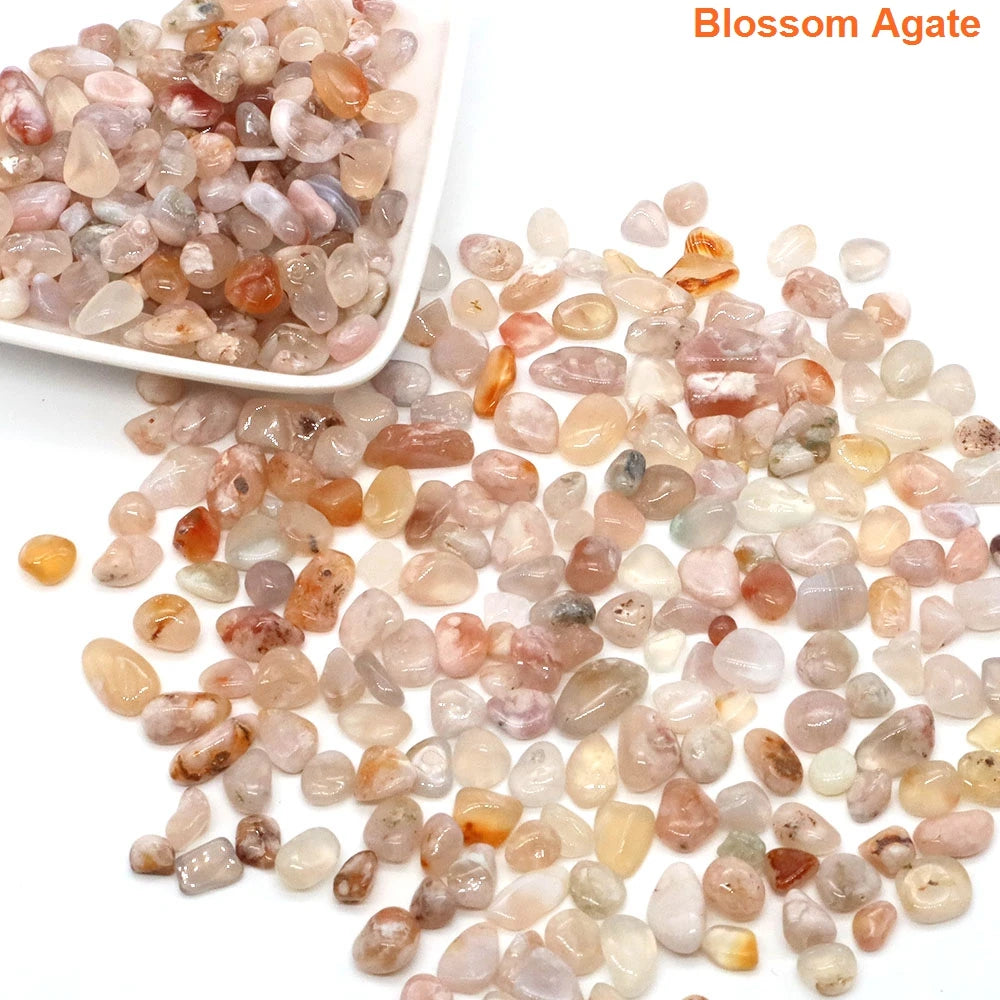 Blossom Agate stones with a bowl on a white background
