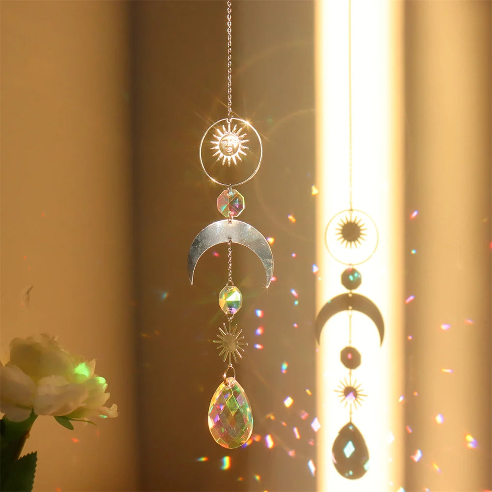 Decorative hanging ornament with celestial design in front of a blurred floral background