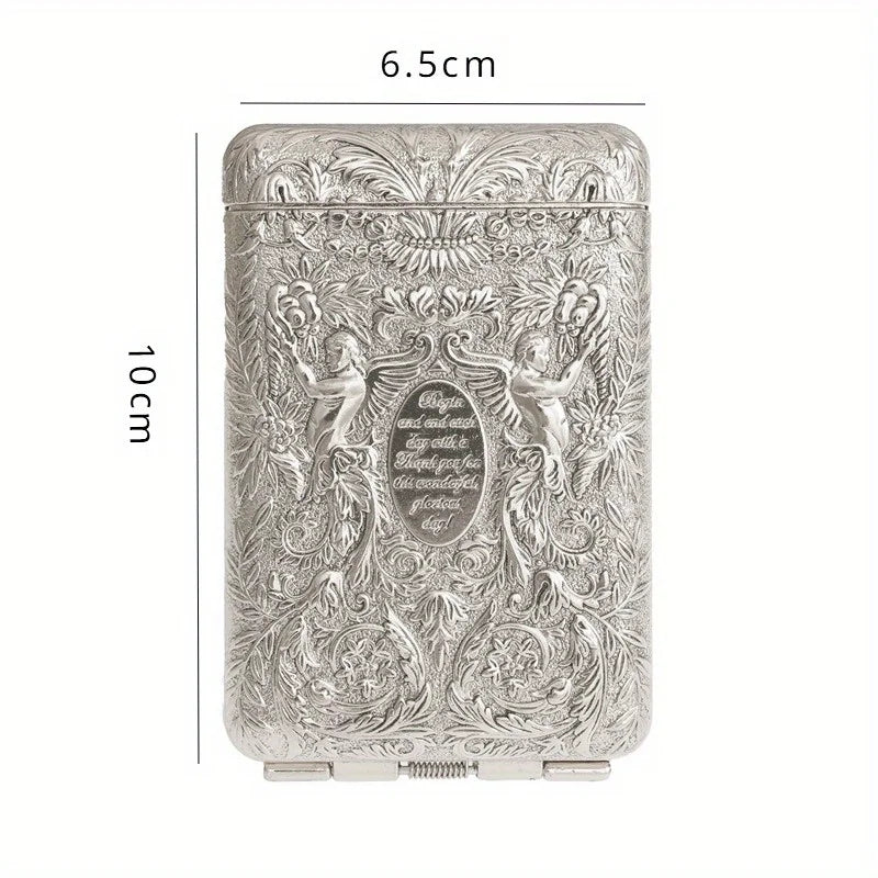 Decorative silver case with engraved design and measurements on a white background