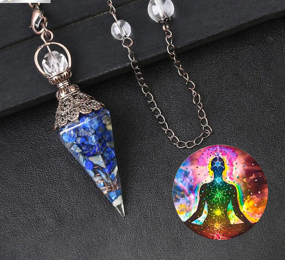 Two pendants on a dark surface, one blue and ornate, the other with a colorful meditating figure.