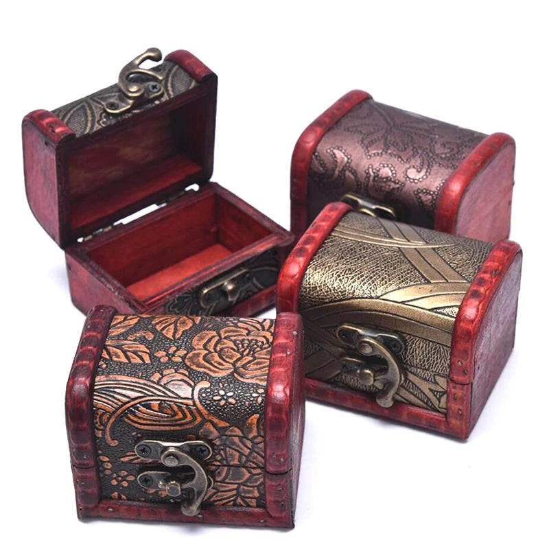 Set of decorative wooden jewelry boxes with intricate patterns and metal accents on a white background.