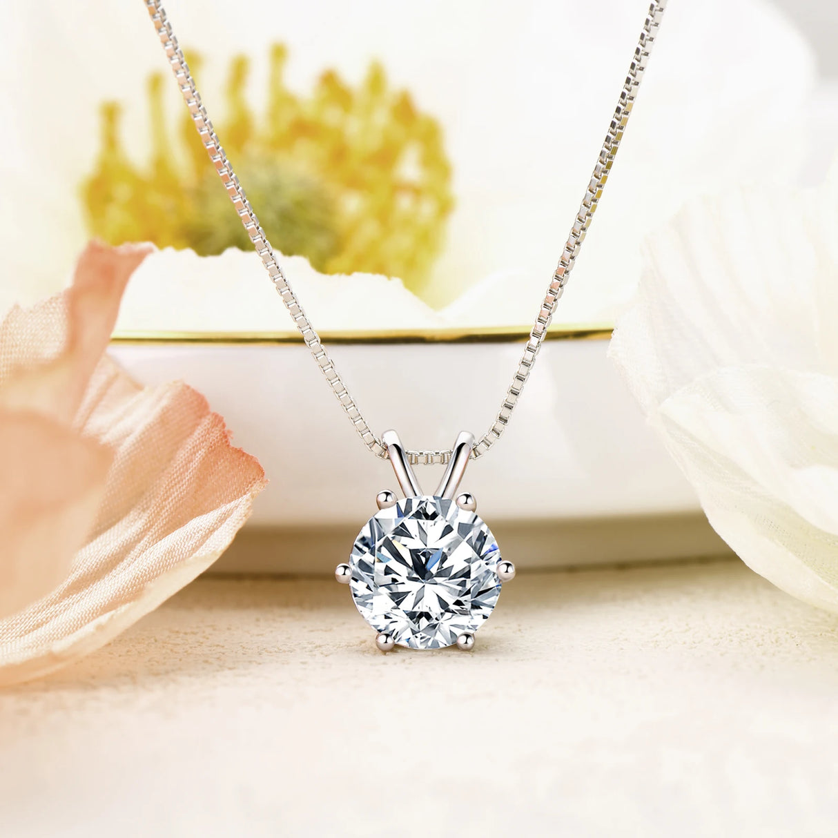 Diamond necklace on a soft background with flowers